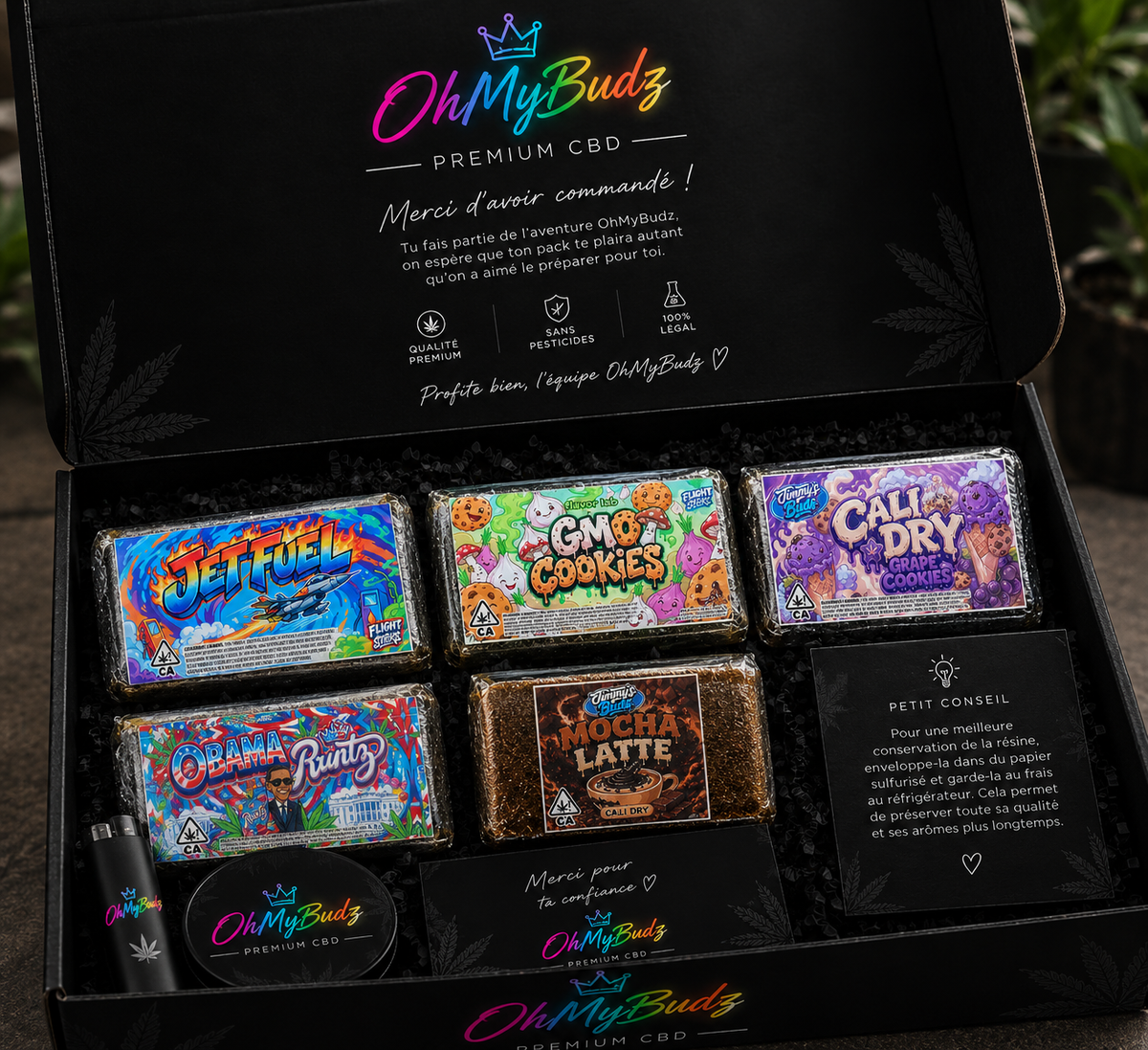 Pack découverte résines OhMyBudz : coffret noir avec cinq blocs de résine CBD, grinder, briquet et conseil de conservation